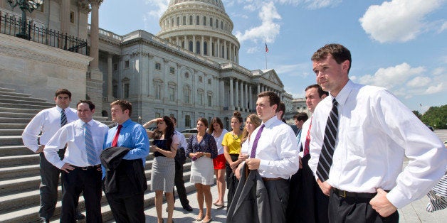 College students wait by the steps of the House of Representatives for Speaker of the House John Boehner, R-Ohio, and GOP leaders to arrive for a news conference on federal student loan rates which doubled on July 1, at the Capitol in Washington, Monday, July 8, 2013. (AP Photo/J. Scott Applewhite)