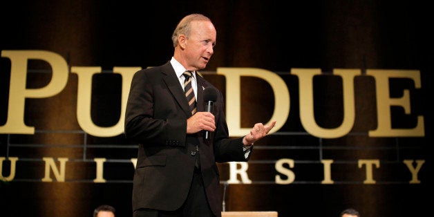 Indiana Gov. Mitch Daniels answers question during a news conference after being named as the next president of Purdue University by the school's trustees in West Lafayette, Ind., Thursday, June 21, 2012. Daniels will take the helm of the school after leaving office in January and succeeds France Cordova who will leave in July after five years at Purdue's helm. (AP Photo/Michael Conroy)