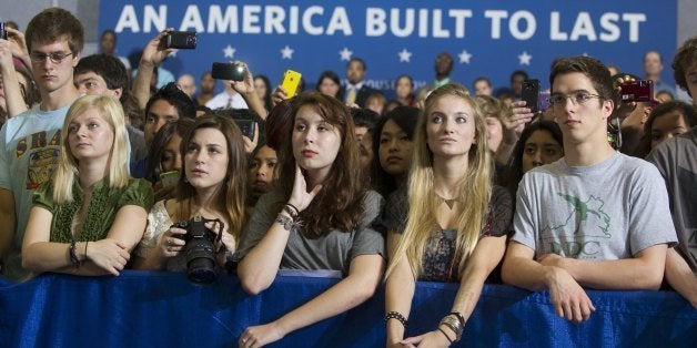 Junior and senior high school students listen as US President Barack Obama speaks on the interest rates of federal subsidized student loans at Washington-Lee High School in Arlington, Virginia, May 4, 2012. Without Congressional intervention, student loan interest rates are set to double on July 1. AFP PHOTO / Saul LOEB (Photo credit should read SAUL LOEB/AFP/GettyImages)