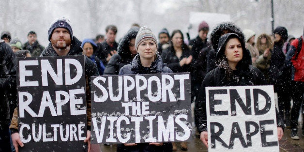 Students and others demonstrate on the Penn State campus in support of women police say were depicted on Kappa Delta Rho frat