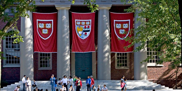 UNITED STATES - SEPTEMBER 03: Harvard banners hang outside Memorial Church on the Harvard University campus in Cambridge, Massachusetts, U.S., on Friday, Sept. 4, 2009. Community activists in Allston, a section of Boston across the Charles River from Harvard's main campus in Cambridge, say university delays have left a (Photo by Michael Fein/Bloomberg via Getty Images)