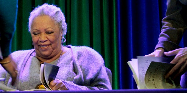 Author Toni Morrison signs copies of her latest book "Home," during Google's online program series, Authors At Google, on Wednesday, Feb. 27, 2013 in New York. (AP Photo/Bebeto Matthews)