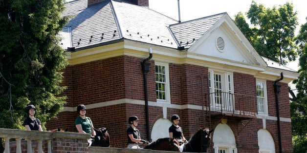 In this photo taken on Wednesday, May 13, 2015, graduating seniors at Sweet Briar college participate on the tradition senior