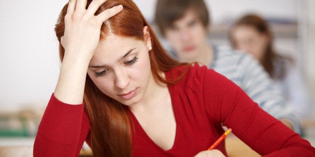 Beautiful female college student doing an exam