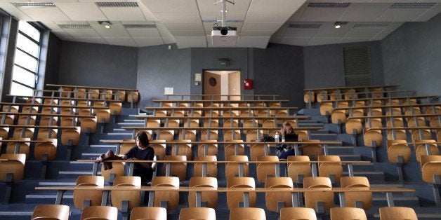 Students in Law wait for a meeting on their first day of classes after the summer break, at the university of the French northwestern city of Caen on September 14, 2015. AFP PHOTO / CHARLY TRIBALLEAU (Photo credit should read CHARLY TRIBALLEAU/AFP/Getty Images)