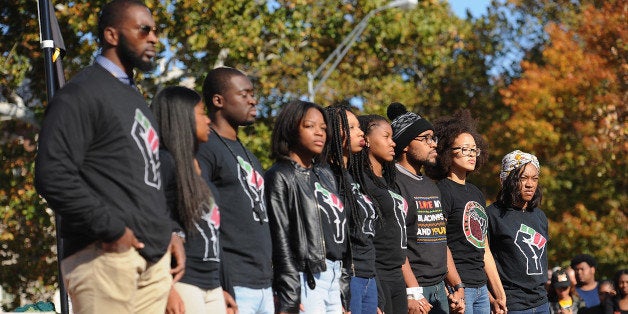 COLUMBIA, MO - NOVEMBER 9: Jonathan Butler (c), a University of Missouri grad student who did a 7 day hunger strike listens along with founding members of the campus group, Concerned Student 1950, during a forum speaking to students on the campus of University of Missouri - Columbia on November 9, 2015 in Columbia, Missouri. Students celebrate the resignation of University of Missouri System President Tim Wolfe amid allegations of racism. (Photo by Michael B. Thomas/Getty Images)