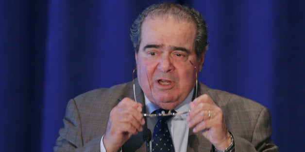 WASHINGTON, DC - SEPTEMBER 15: U.S. Supreme Court Associate Justice Antonin Scalia addresses the The Legal Services Corporation's 40th anniversary conference luncheon Septemeber 15, 2014 in Washington, DC. Former Secretary of State Hillary Clinton is also scheduled to address the LSC, which was established by the Congress in 1974 'to provide equal access to justice and to ensure the delivery of high-quality civil legal assistance to low-income Americans.' (Photo by Chip Somode/Getty Images)