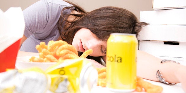 Woman sleeping after eating a lot of food