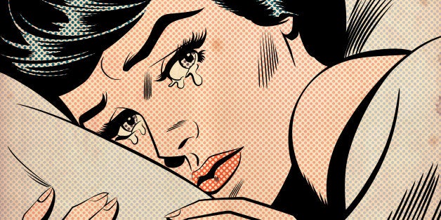Woman crying in bed