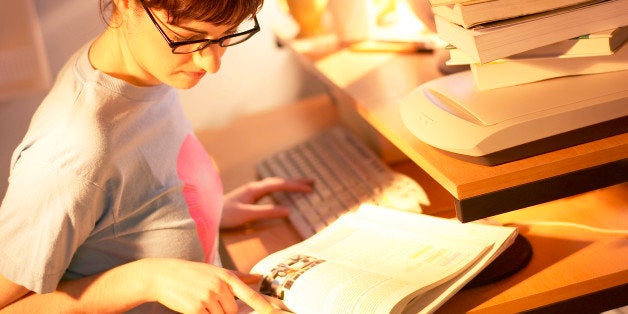 Young woman doing homework