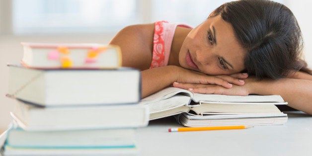 USA, New Jersey, Jersey City, Female student leaning on books