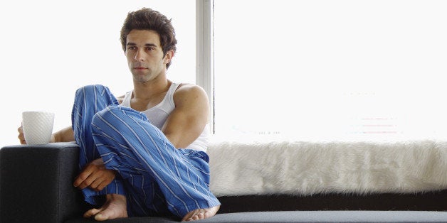 Disinterested couple sitting on sofa