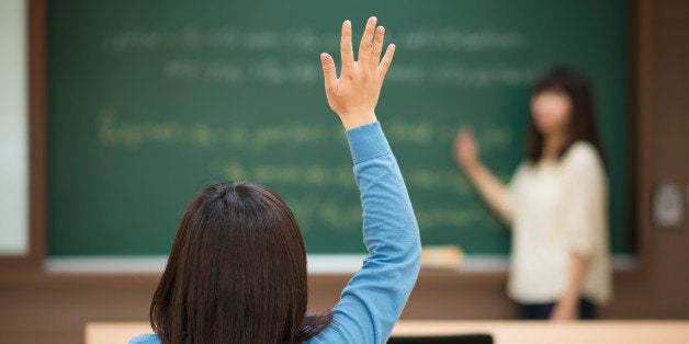 There is a teacher stand in front of the classroom