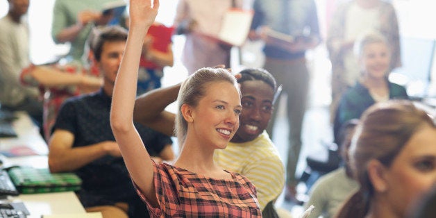 University student raising hand at IT seminar