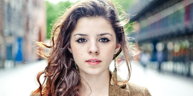 Portrait of young woman with brown hair