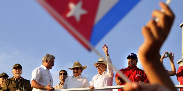 HAVANA, May 1, 2016-- Cuban leader Raul Castro, center, the Second Secretary of the Communist Party of Cuba Jose Ramon Machado (R, center) and the First Vice President of Cuba Miguel Diaz-Canel, left center, watch the parade in Revolutionary Square in Havana, Cuba, on May 1, 2016. More the 500,000 locals and foreigners took part in Cuba's International Workers' Day parade here on Sunday, also celebrating the 90th birthday of Cuban revolutionary leader Fidel Castro. (Xinhua/Joaquin Hernandez via Getty Images)