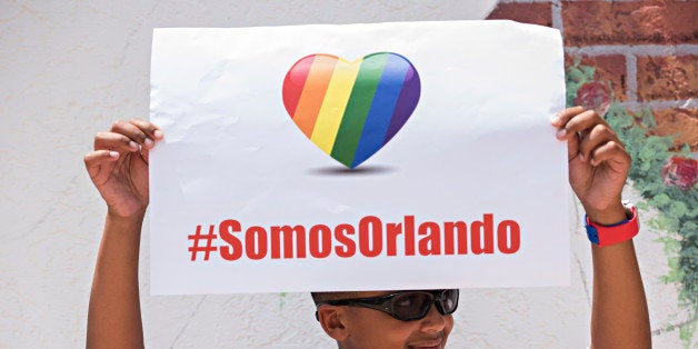 ORLANDO, FLORIDA - JUNE 13, 2016: Geoffrey Brooks, 12, of Orlando, holds a sign declaring 'We are Orlando' at a press conference Monday at the Hispanic Federation, which encompasses several latino organizations including the Asociacion De Puertorriqueños, a group that his mother is a member of. 'I was surprised when I found out what happened.' said Brooks. 'My mom told me to look at the news, then she told me just to listen. We came out today to support both Orlando and the latino community.' A gunmen opened fire in a gay nightclub in Orlando, Fla. early Sunday morning killing 49 people and wounding 53 more. It's being called the worst mass shooting in U.S. history.(Photo by Melissa Lyttle for The Washington Post via Getty Images)