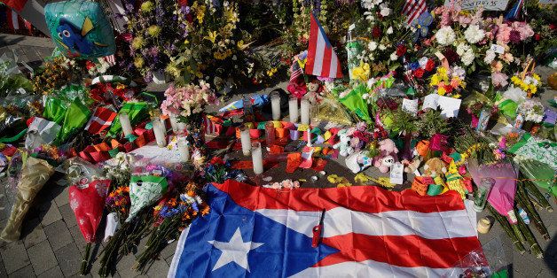 ORLANDO, FL - JUNE 15: A Puerto Rican flag is left at a makeshift memorial near Orlando Regional Medical Center, down the street from the crime scene at Pulse Nightclub, June 15, 2016 in Orlando, Florida. The shooting at Pulse Nightclub, which killed 49 people and injured 53, is the worst mass-shooting event in American history. (Photo by Drew Angerer/Getty Images)