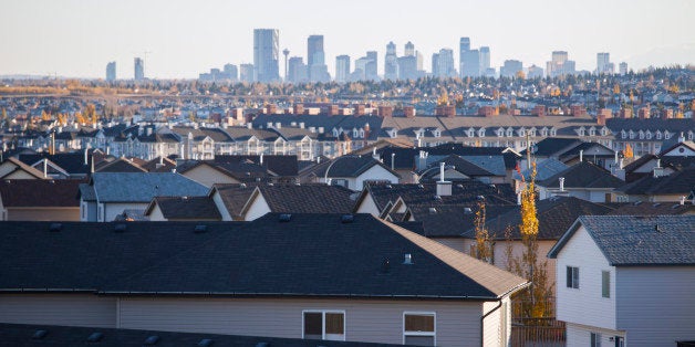 Houses in suburban neighborhood with city in background