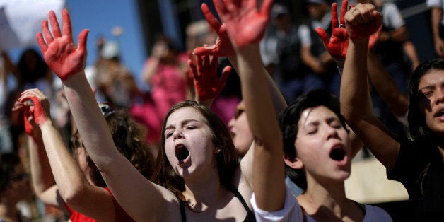 Demonstrators attend a protest against rape and violence against women in Brasilia, Brazil, May 29, 2016. REUTERS/Ueslei Marc