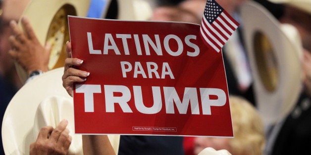 CLEVELAND, OH - JULY 21: A delegate holds up sign that reads 'Latinos Para Trump' during the evening session on the fourth day of the Republican National Convention on July 21, 2016 at the Quicken Loans Arena in Cleveland, Ohio. Republican presidential candidate Donald Trump received the number of votes needed to secure the party's nomination. An estimated 50,000 people are expected in Cleveland, including hundreds of protesters and members of the media. The four-day Republican National Convention kicked off on July 18. (Photo by Jeff Swensen/Getty Images)