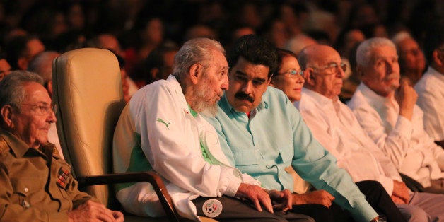 TOPSHOT - In this handout picture released by Prensa Miraflores, former Cuban President Fidel Castro (2nd L), sitting between Venezuelan President Nicolas Maduro (3rd L) and Cuban President Raul Castro (L), is seen attending the celebration of his 90th birthday at the Karl Marx theatre in Havana on August 13, 2016. / AFP / Prensa Miraflores / Marcelo Garcia / XGTY/RESTRICTED TO EDITORIAL USE-MANDATORY CREDIT 'AFP PHOTO/PRENSA MIRAFLORES' NO MARKETING NO ADVERTISING CAMPAIGNS-DISTRIBUTED AS A SERVICE TO CLIENTS-GETTY OUT (Photo credit should read MARCELO GARCIA/AFP/Getty Images)