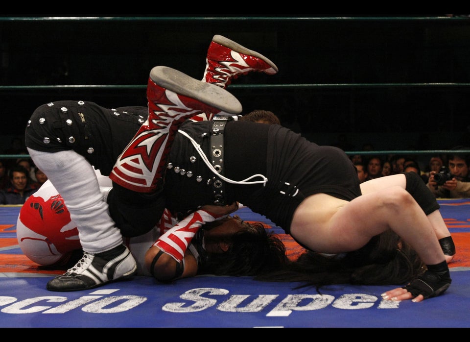 Two women fight during a combat of "Lucha Libre"