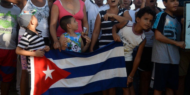 Cuban migrants demonstrate demanding to be allowed to travel to the United States in thee Turbo municipality, Antioquia department, Colombia on August 5, 2016. More than 2.000 Cuban migrants are in the country after Panama closed the border with Colombia last May 9 to stop the flow of mainly Cuban migrants in a desperate bid to reach the United States / AFP / RAUL ARBOLEDA (Photo credit should read RAUL ARBOLEDA/AFP/Getty Images)