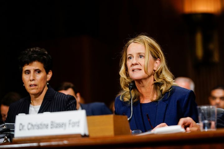 Christine Blasey Ford, with lawyer Debra S. Katz, left, answers questions at a Senate Judiciary Committee hearing.