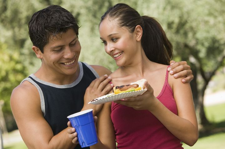 couple sharing food at picnic