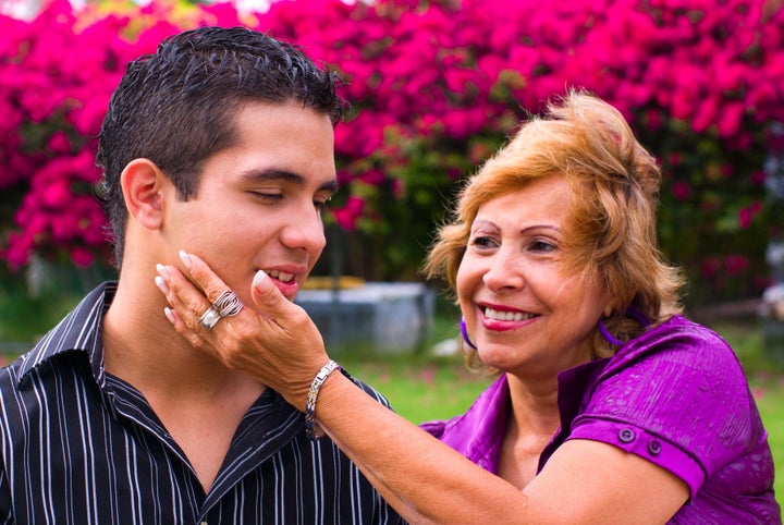 grandmother caressing teen boy...