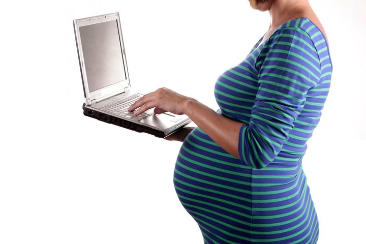 pregnant woman with laptop...