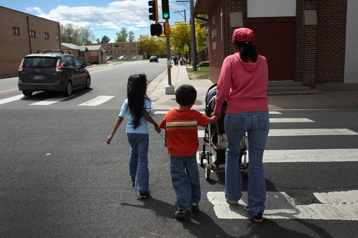 AURORA, CO - MAY 21: Undocumented Mexican immigrant Jeanette Vizguerra walks home with her three American-born children on May 21, 2011 in Aurora, Colorado. Vizguerra is facing deportation to Mexico and is scheduled for a final hearing July 13 at Denver's Federal Courthouse. Just one of millions of undocumented immigrants living in the United States, Vizguerra first came to Colorado from Mexico City with her husband 14 years before. She is a small business owner of a janitorial service and a community organizer for immigration rights. Stopped two years ago by a traffic policemen for driving with expired tags, Vizguerra was taken to jail when she could not prove she was in the country legally. Out on bail during lengthy court proceedings, she now faces the real possibility that she will be deported back to Mexico and separated from her family in the United States. (Photo by John Moore/Getty Images)