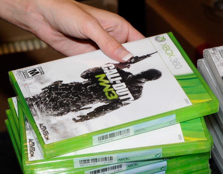 NORTH LAS VEGAS, NV - NOVEMBER 08: GameStop employee Randi Taber rings up copies of 'Call of Duty: Modern Warfare 3' for the Xbox 360 during a launch event for the highly anticipated video game at a GameStop Corp. store November 8, 2011 in North Las Vegas, Nevada. Video game publisher Activision released the eighth installment in the 'Call of Duty' franchise at midnight. (Photo by Ethan Miller/Getty Images)