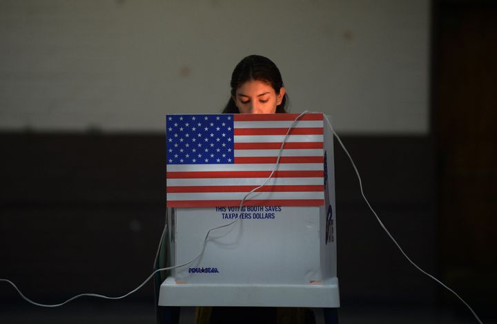 A Sun Valley resident votes at the polling station located at Our Lady of The Holy Church on election day at the Sun Valley's Latino district, Los Angeles County, on November 6, 2012 in California. AFP PHOTO /JOE KLAMAR (Photo credit should read JOE KLAMAR/AFP/Getty Images)