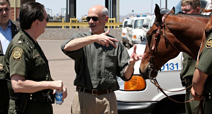 DOUGLAS, AZ - MAY 5: U.S. Secretary of Homeland Security Michael Chertoff (C) speaks with an unidentified U.S. Border Patrol agent after addressing the media at a press conference at the U.S. Border Patrol Station May 5, 2005 in Douglas, Arizona. Chertoff toured the border at Douglas and Yuma, Arizona and U.S. Border Patrol facilities along with U.S. Senator John McCain (R-AZ.), U.S. Senator Jon Kyl (R-AZ.) and Arizona Governor Janet Napolitano. (Photo by Jeff Topping/Getty Images)