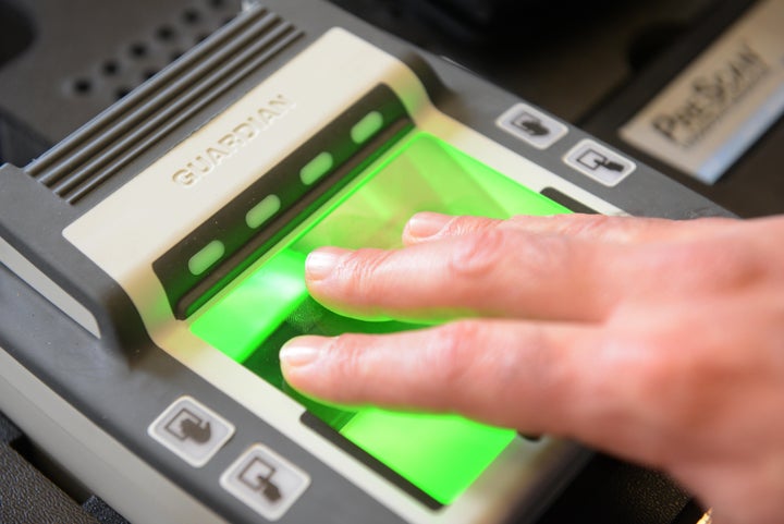 TO GO WITH AFP STORY by Sebastien Blanc A photo taken on September 8, 2012 shows a fingerprint reader collecting biometric da