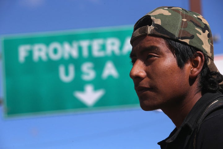 NOGALES, MEXICO - MARCH 10: An immigrant walks near the U.S.-Mexico border after eating breakfast at the Kino Border Initiat