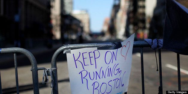 BOSTON - APRIL 17: A sign hangs on a barricade to Boylston Street at Berkeley Street, looking towards scene of the bombing, two days after two explosions went off at the finish line of the 117th Boston Marathon. (Photo by Bill Greene/The Boston Globe via Getty Images)