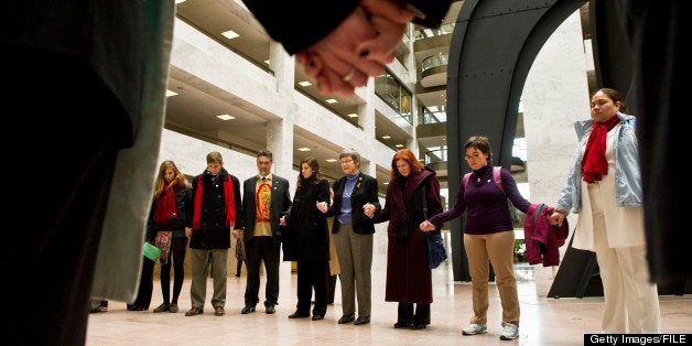 WASHINGTON, DC- Dec. 14: Participants in a 'Jericho March' and rally in support of the DREAM Act pray in the atrium of the Hart Senate Office Building. The event was sponsored by Faith in Public Life. (Photo by Scott J. Ferrell/Congressional Quarterly/Getty Images)