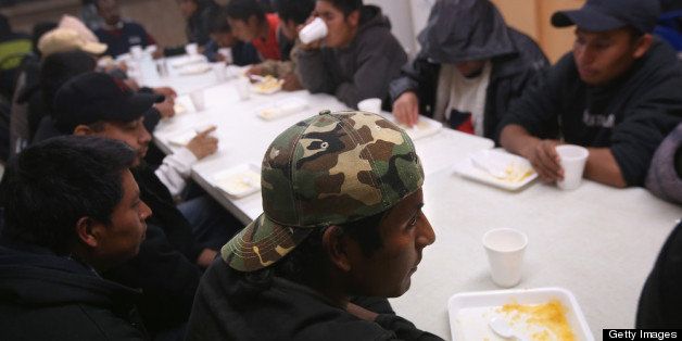 NOGALES, MEXICO - MARCH 9: Immigrants eat at the San Juan Bosco shelter on March 9, 2013 in Nogales, Mexico. The shelter is the largest in Nogales and often houses more than one hundred immigrants per night, including those recently deported from the United States and those about to try and cross into the U.S. illegally. (Photo by John Moore/Getty Images)