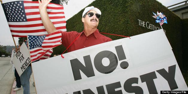 Los Angeles, UNITED STATES: Larry Culbertson of the Minutemen Project joins other anti-illegal immigration protestors outside the Getty Center in Los Angeles, 26 May 2006 where Mexican President Vicente Fox and Los Angeles Mayor Antonio Villaraigosa are scheduled to meet. The two officials are expected to discuss tourism and trade but Villaraigosa says he won't discuss immigration with Fox because its outside his control. The President's visit to California is the last leg of a three-state visit to the United States. AFP PHOTO / Robyn BECK (Photo credit should read ROBYN BECK/AFP/Getty Images)