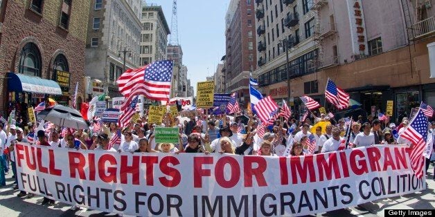 Demonstrators seeking change in immigration policy march on May Day in Los Angeles, California, May 01, 2013. Some 2,000 demonstrators marched in May Day rallies calling for immigration reform, a key issue just north of the US-Mexican border. AFP PHOTO/JOE KLAMAR (Photo credit should read JOE KLAMAR/AFP/Getty Images)