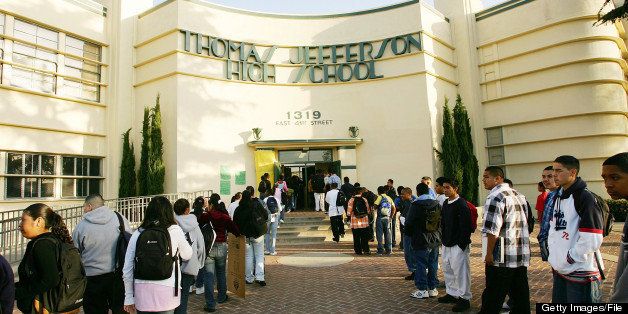 LOS ANGELES, CA - APRIL 21: Students line up to pass through a security check point in the aftermath of two apparent racially motivated student brawls at Thomas Jefferson High School April 21, 2005 in Los Angeles, California. A number of students suffered injuries this week while fleeing from a lunch period brawl involving about 200 Latino and African-American students, the second racially charged incident in less than a week. Stepped-up school police and Los Angeles police presence, strict regulation of clothing styles that could be associated with gangs, and a tightened school bell schedule that leaves little time to linger between classes are in effect to curb the violence. (Photo by David McNew/Getty Images)
