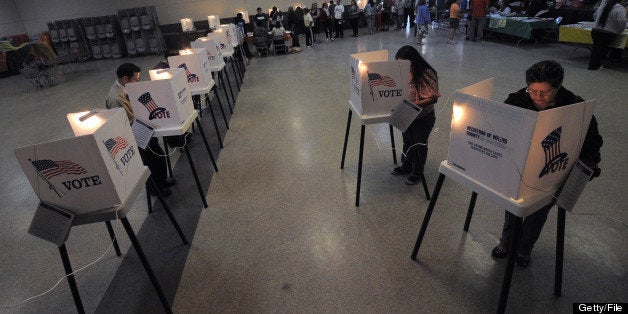 Sun Valley residents vote at the polling station located at Our Lady of The Holy Church on election day at the Sun Valley's Latino district, Los Angeles County, on November 6, 2012 in California. AFP PHOTO /JOE KLAMAR (Photo credit should read JOE KLAMAR/AFP/Getty Images)