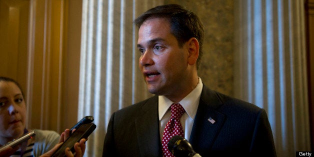 UNITED STATES - May 7 : Sen. Marco Rubio, R-Fl., talks with reporters about immigration reform on his way to the luncheons in the U.S. Capitol on May 7, 2013. (Photo By Douglas Graham/CQ Roll Call)