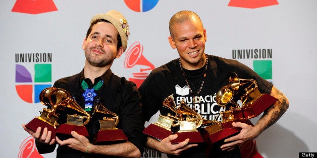 LAS VEGAS, NV - NOVEMBER 10: Eduardo Cabra Martinez a.k.a. Vistante (L) and Rene Perez Joglar a.k.a. Residente of the musical group Calle 13 pose in the press room with their multiple Latin Grammy Awards during the 12th annual Latin GRAMMY Awards at the Mandalay Bay Resort & Casino on November 10, 2011 in Las Vegas, Nevada. (Photo by Steven Lawton/FilmMagic)