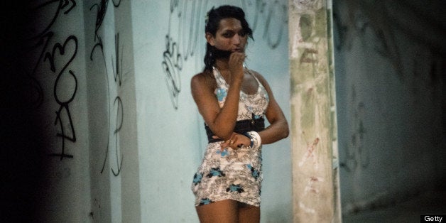 A prostitute stands along a street in Fortaleza, Ceara State, northeastern Brazil, on April 16, 2013. AFP PHOTO/Yasuyoshi CHIBA (Photo credit should read YASUYOSHI CHIBA/AFP/Getty Images)