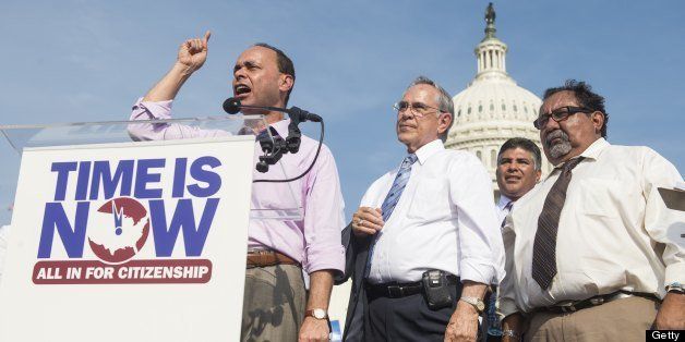 UNITED STATES - APRIL 10: From left, Rep. Luis Gutierrez, D-Ill., speaks to immigration reform supporters as Rep. Ruben Hinojosa, D-Texas, and Rep. Raul Grijalva, D-Ariz., listen during the National Rally for Citizenship on the west lawn of the U.S. Capitol on Wednesday, April 10, 2013. (Photo by Bill Clark/Getty Images)