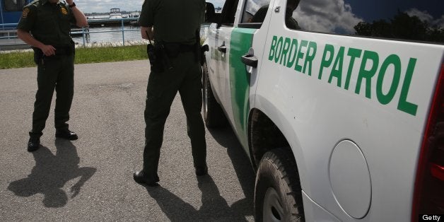 BEAVER ISLAND STATE PARK, NY - JUNE 03: U.S. Border Patrol agents talk while at a marina on the Niagara River at the U.S.-Can